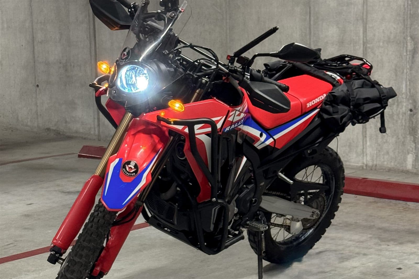 Honda CRF300L Rally parked indoors